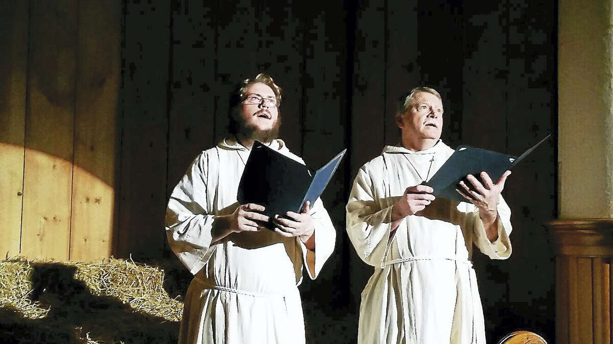 N.F. Ambery photo Soloists John Eggering and Brian Tassinari, dressed as Medieval monks, performed “O Come, O Come, Emmanuel” at the 26th annual Boar’s Head Festival.