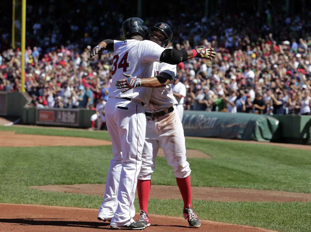 David Ortiz, left, celebrates his home run with teammate Xander Bogaerts in the first inning Sunday.