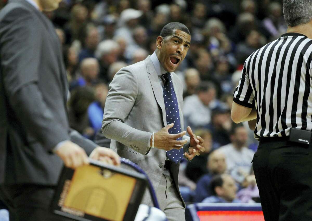 UConn head coach Kevin Ollie reacts in the first half of Saturday’s game against Memphis.