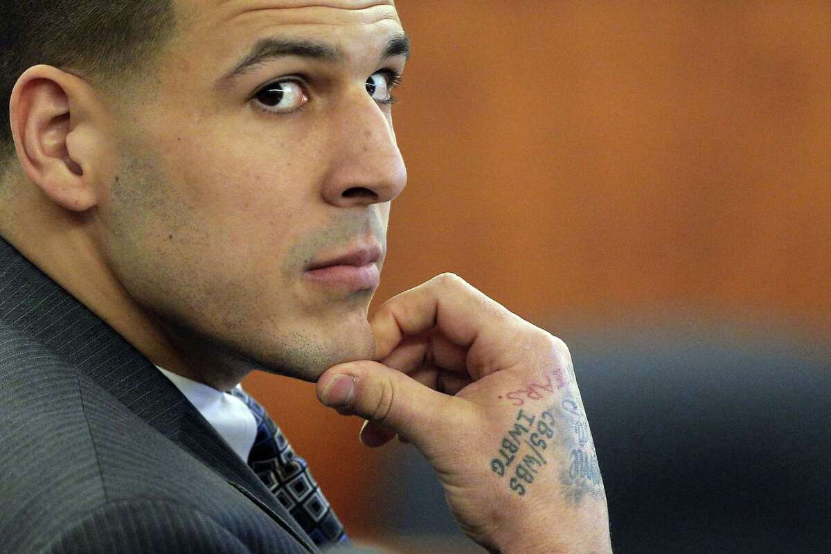 In this April 1 file photo, former New England Patriots star Aaron Hernandez listens during his murder trial in Fall River, Mass.