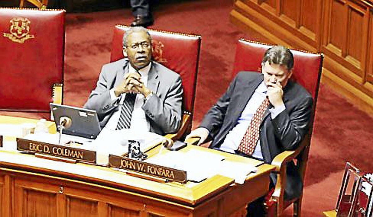 State Sens. Eric Coleman and John Fonfara sit in the Senate chamber.