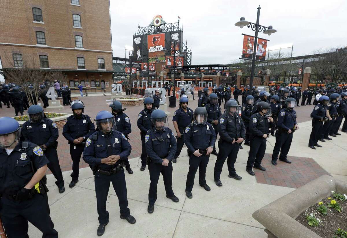 Police stand in formation outside Oriole Park at Camden Yards during a protest for Freddie Gray on April 25 in Baltimore.