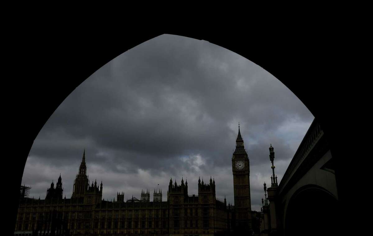 Britain’s Houses of Parliament are silhouetted through an archway in London, Thursday, May 7, 2015. Britain’s most unpredictable general election in decades gets under way Thursday with polls showing the two biggest parties Labour and the Conservatives running in a virtual dead heat. The election could decide issues such as whether Britain will remain a member of the European Union, whether it will close its doors to immigrants and whether it will continue with austerity programs.
