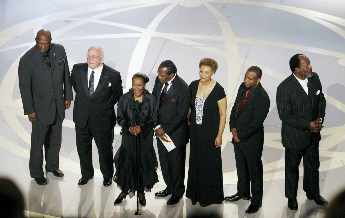 In this Sept. 16, 2007, file photo, “Roots” cast members from left, Louis Gossett Jr., Edward Asner, Cicely Tyson, Ben Vereen, Leslie Uggams, LaVar Burton and John Amos participate in a tribute to “Roots” during the 59th Primetime Emmy Awards in Los Angeles. In time for its 40th anniversary next year, “Roots: The Complete Original Series” is being re-released June 7, 2016, on Blu-ray by Warner Bros.