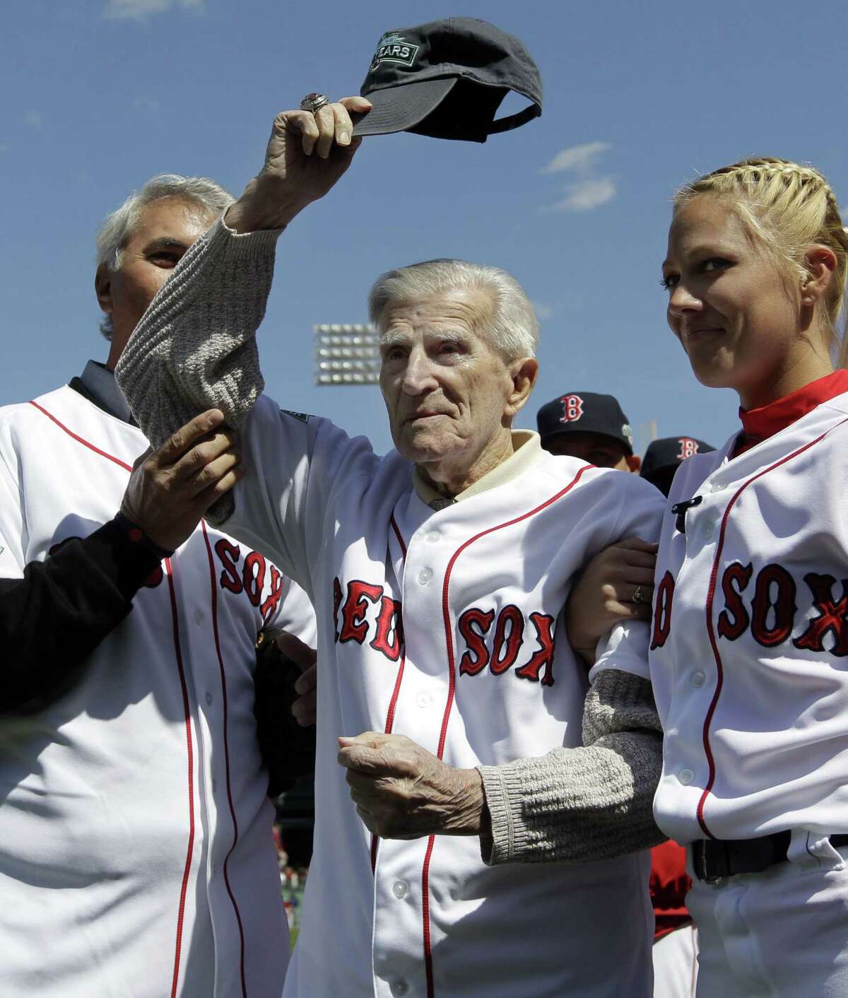 In this April 13, 2012 photo, Boston Red Sox great Johnny Pesky tips his cap to the fans prior to Boston’s home opener baseball game against the Tampa Bay Rays at Fenway Park in Boston. Pesky died in Danvers, Mass. at 92.