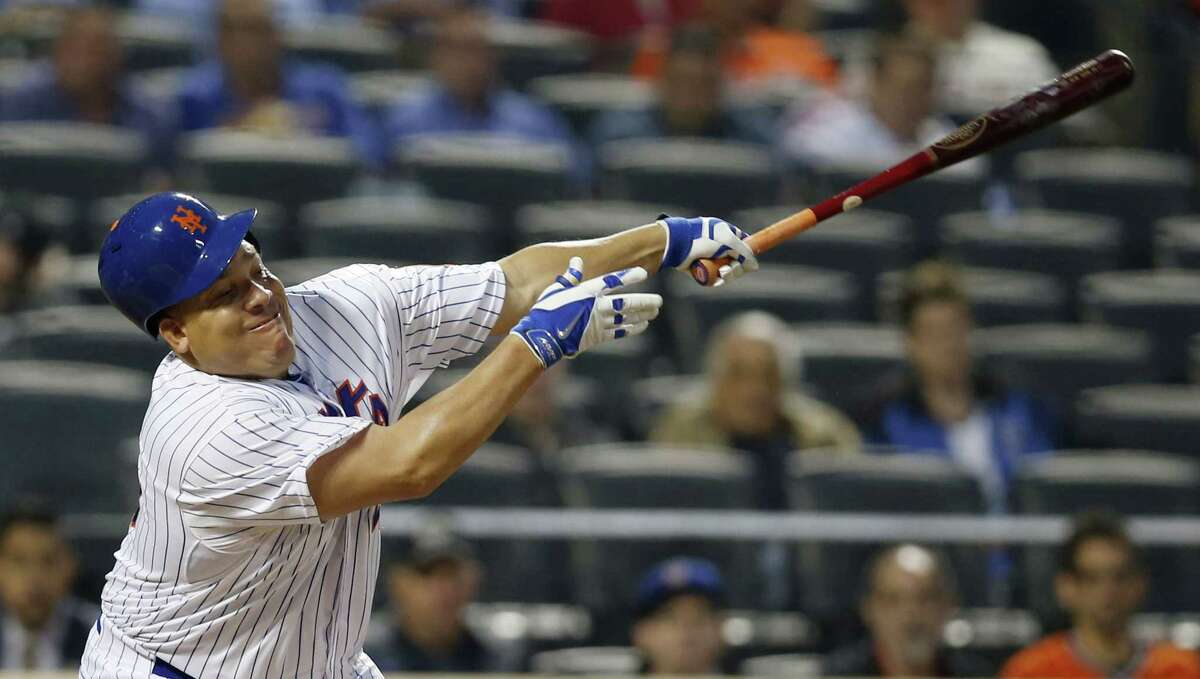 New York Mets Bartolo Colon loses his helmet as he bats in a baseball game against the Baltimore Orioles in New York, Tuesday, May 5, 2015. (AP Photo/Kathy Willens)