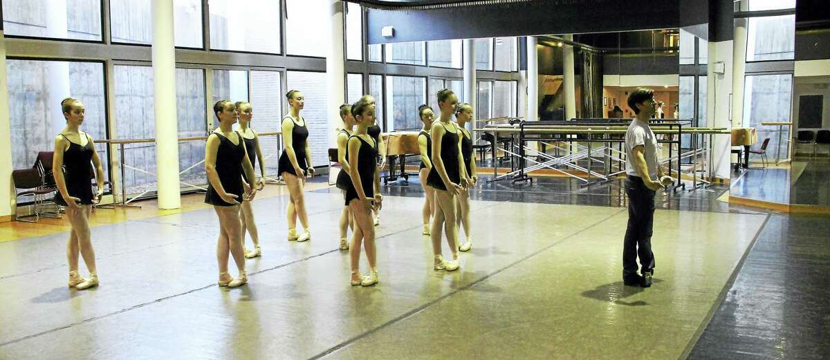 Tom Gold, right, and advanced students work on a piece at New Haven Ballet studios on Audubon Street.