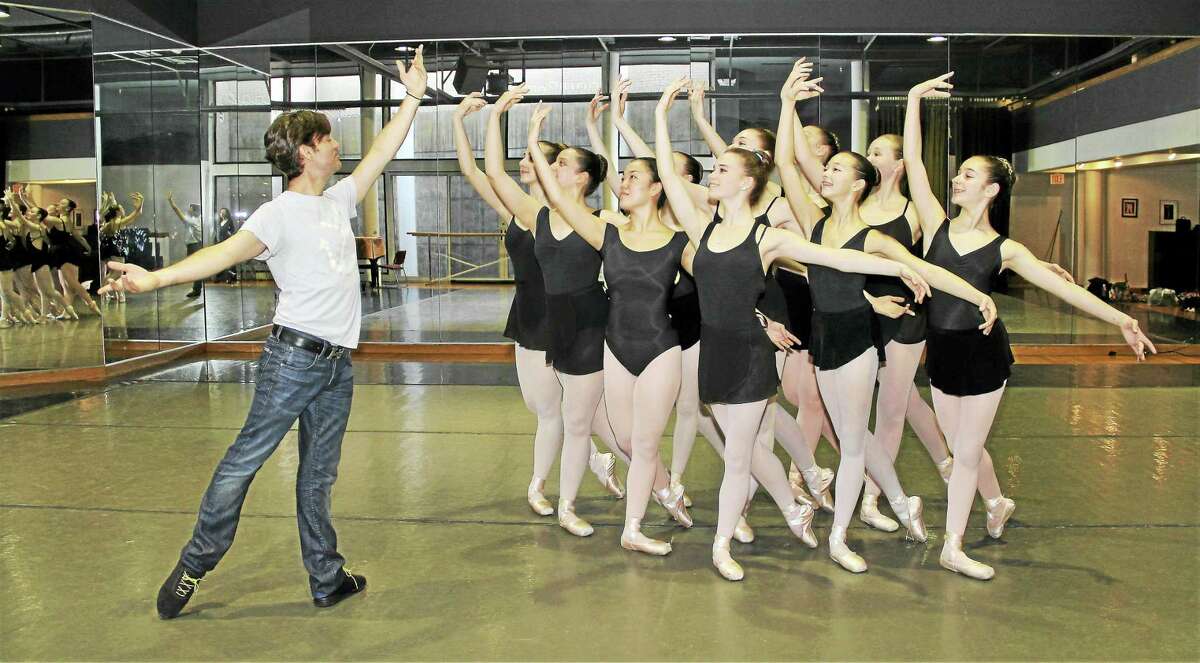 Guest choreographer Tom Gold, left, and New Haven Ballet students.