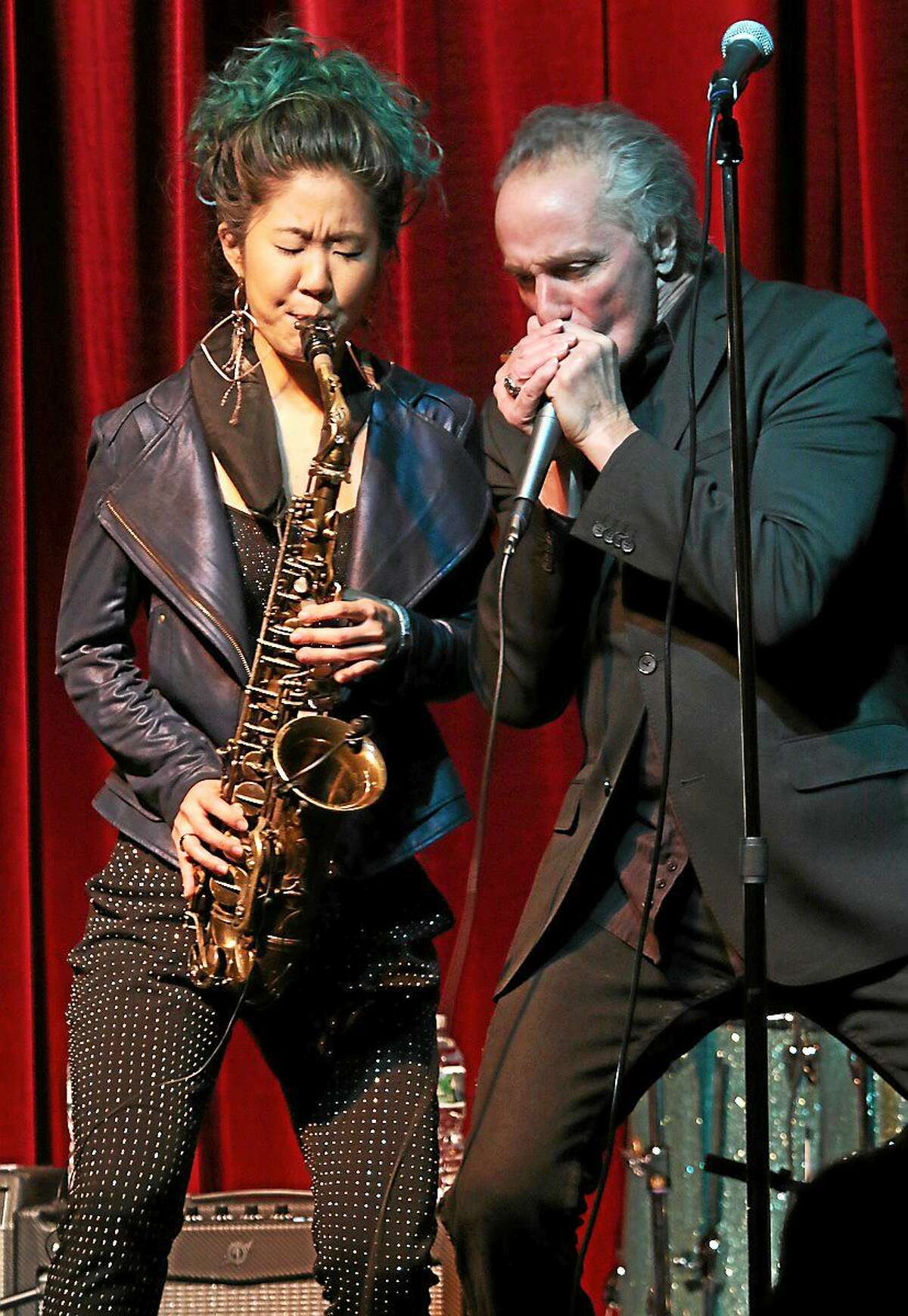 Photo by John Atashian Saxophonist Grace Kelly is shown jamming with harmonica player and band leader James Montgomery during a live concert appearance at Bridge Street Live in Collinsville on Dec. 18. Kelly became the youngest ever musician voted to the ìDown Beatî Magazineís Critics Poll at age 16. At 18, she released her sixth album, ìMan With the Hat,î a collaboration with jazz legend Phil Woods.
