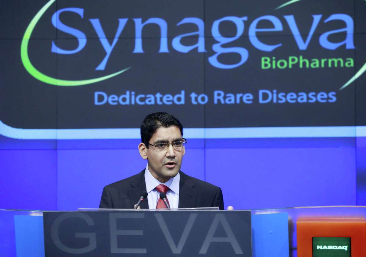 In this Nov. 3, 2011 photo, Sanj Patel, President and CEO of Synageva BioPharma Corp., attends the opening bell ceremony at Nasdaq in New York. Alexion Pharmaceuticals on May 6, 2015 announced it is spending $8.4 billion to buy fellow rare disease treatment maker Synageva BioPharma, a company with no products on the market.