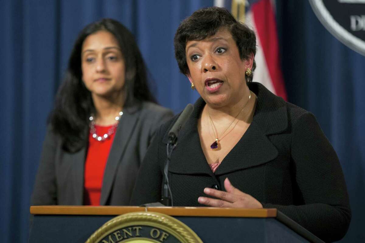 Vanita Gupta, head of the Justice Department’s civil rights division listens at left as Attorney General Loretta Lynch speaks during a news conference at the Justice Department in Washington, Monday, May 9, 2016. North Carolina Gov. Pat McCrory’s administration sued the federal government Monday in a fight for a state law that limits protections for lesbian, gay, bisexual and transgender people.
