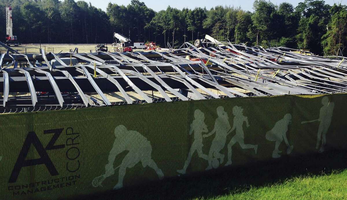 Bent steel covers a construction site where an athletic practice facility being built on the Bryant University campus collapsed Tuesday in Smithfield, R.I. Workers were installing steel beams on the new facility around 8:15 a.m., when the beams collapsed, university spokeswoman Elizabeth O’Neil said.