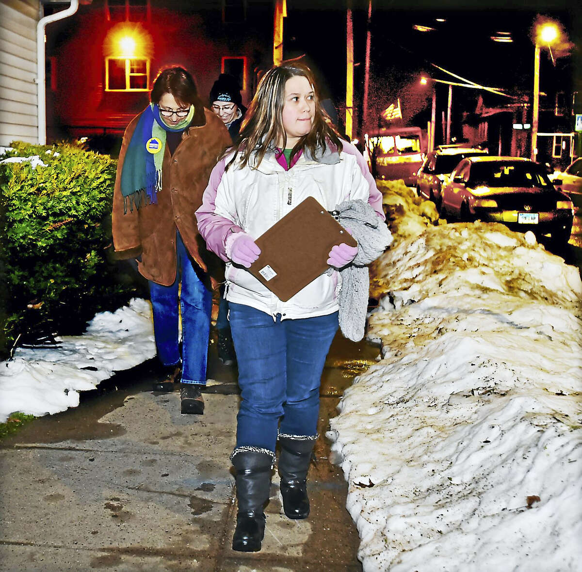 Team leader Veronica Cruz walks on Lloyd Street in the Fair Haven section of New Haven looking for homeless people during the 2016 Point in Time Homeless Count.