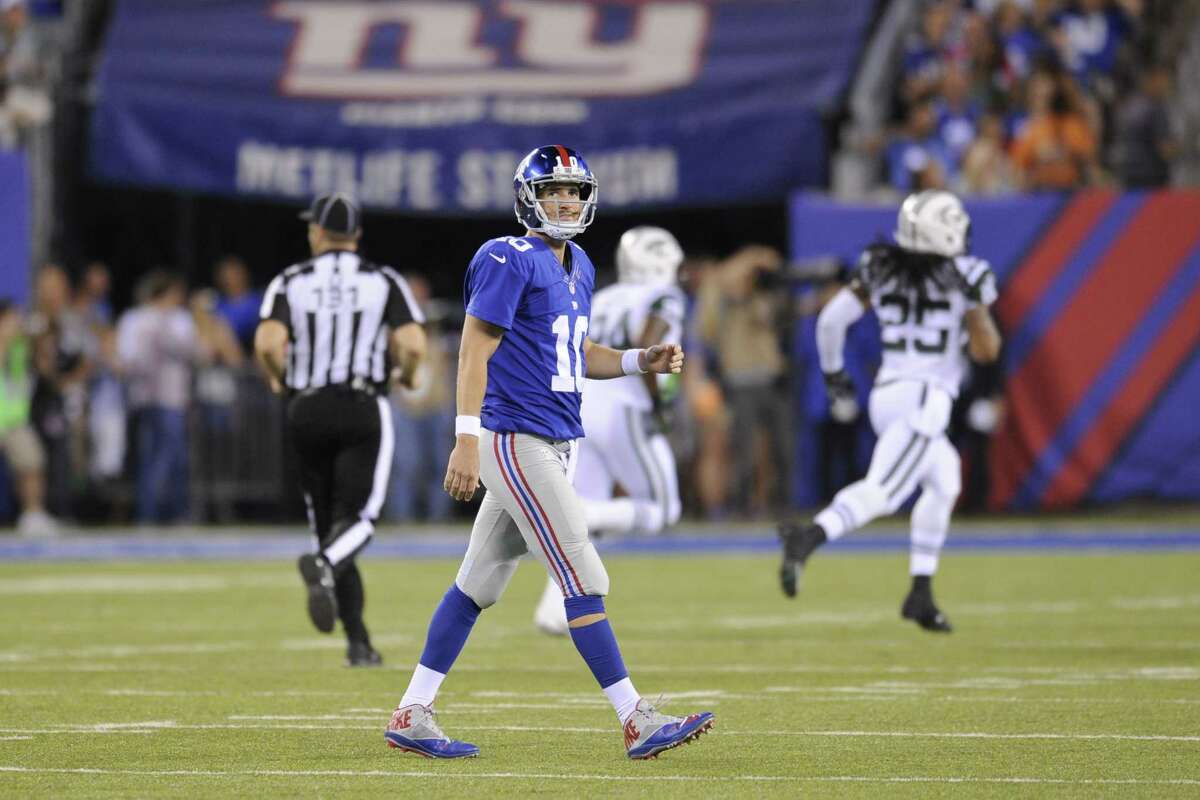 New York Giants quarterback Eli Manning reacts after throwing an interception during a preseason game against the New York Jets on Saturday in East Rutherford, N.J.