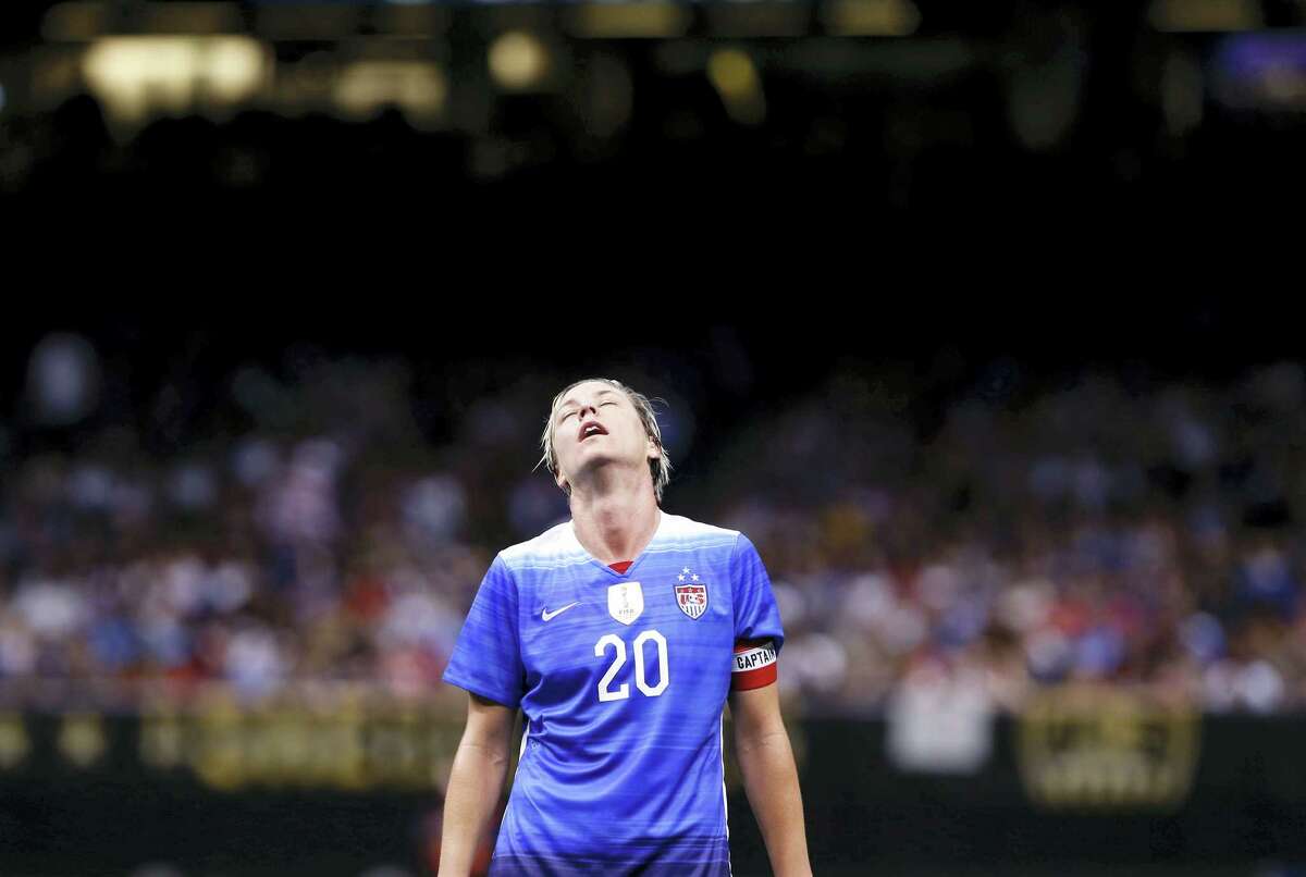 In this Dec. 16, 2015 photo, U.S. forward Abby Wambach reacts during the first half of an international friendly soccer match against China in New Orleans. Wambach says she abused alcohol and prescription drugs for years until her arrest for driving under the influence in April.