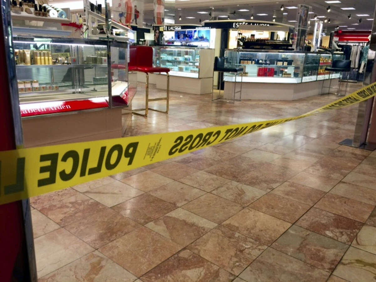 Crime scene tape is seen inside the Macy’s at the Silver City Galleria mall in Taunton, Mass., Tuesday, May 10, 2016. Multiple people have been stabbed in separate attacks at the mall and a home in Massachusetts.