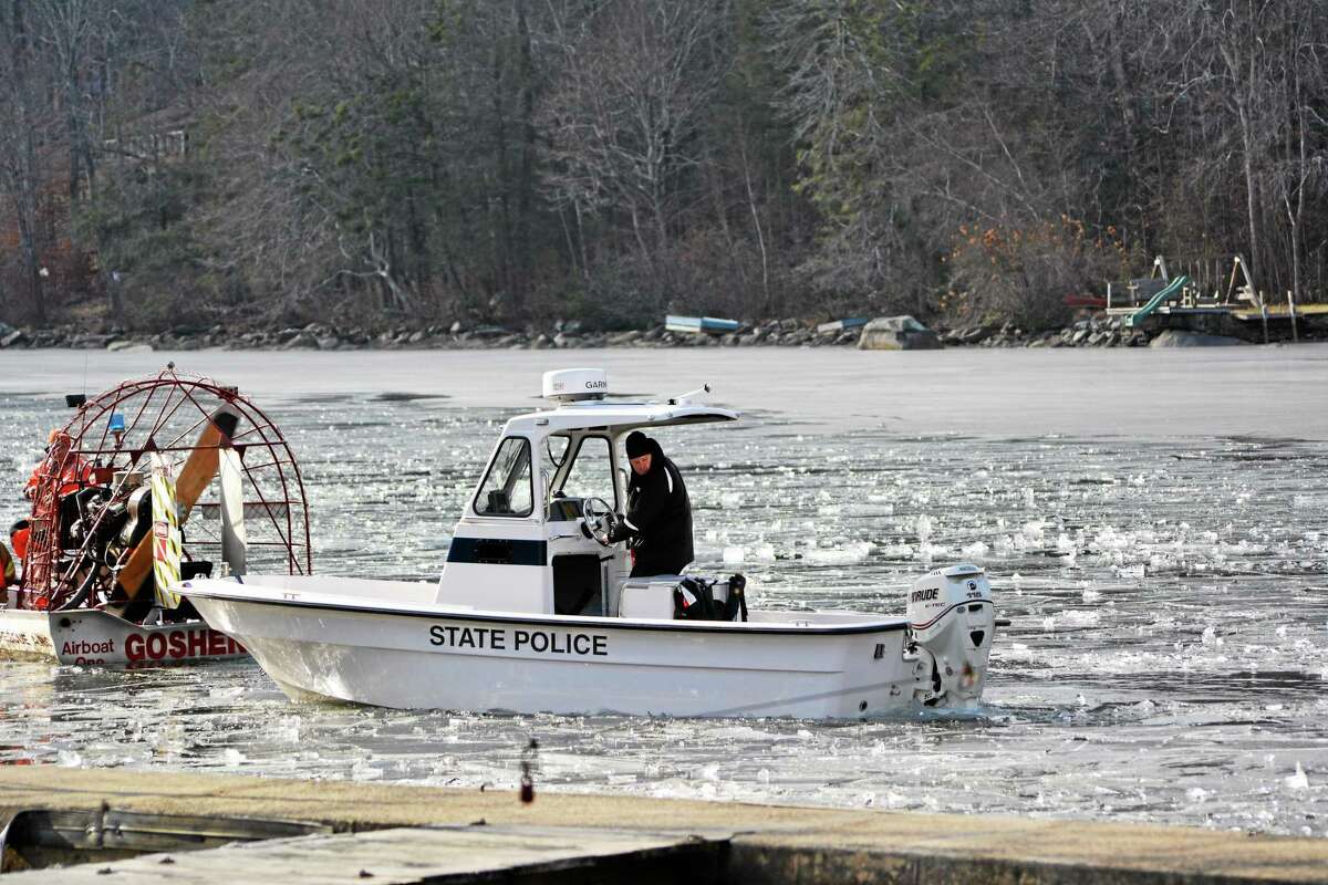 An airboat from Goshen Fire Department breaks up ice on West Hill Pond so a state police boat could search the area for a missing kayaker.