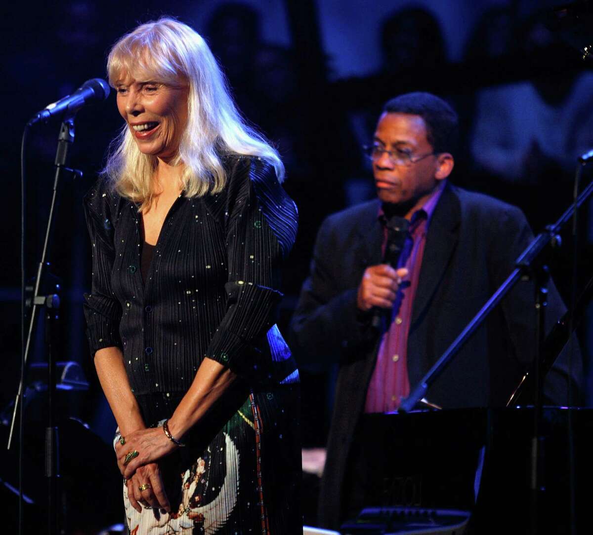 This March 20, 2008 file photo shows Joni Mitchell, left, and Herbie Hancock perform as part of Nissan Live Sets on Yahoo! Music in Los Angeles.