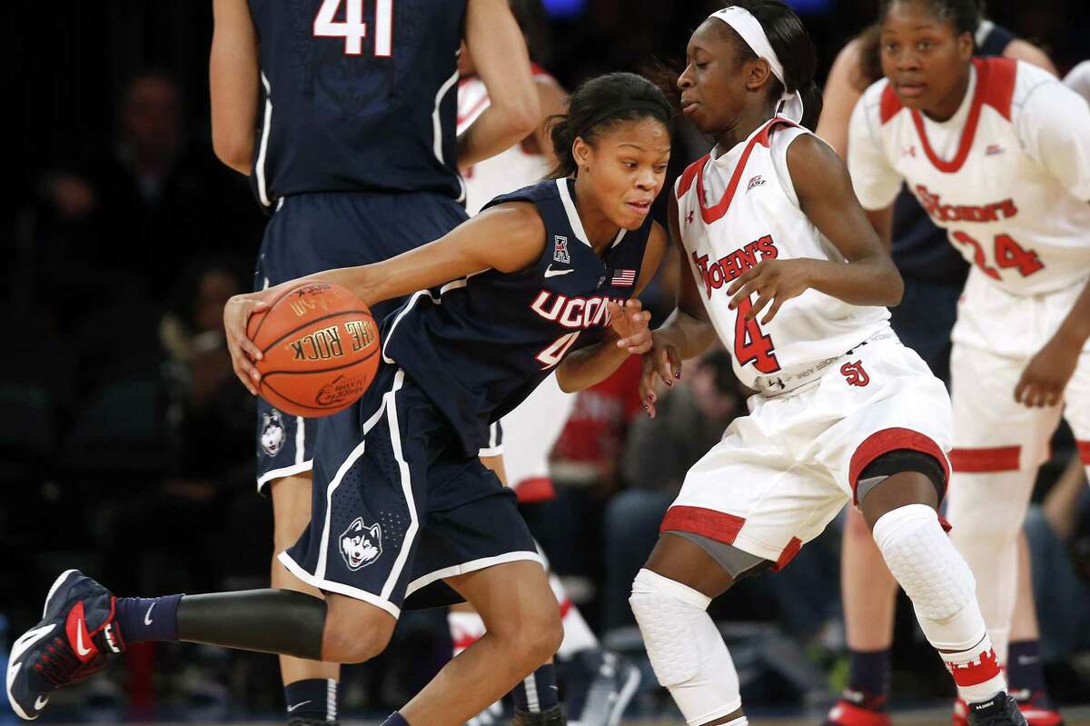 UConn’s Moriah Jefferson, left, drives against St. John’s Aaliyah Lewis during the first half Sunday.