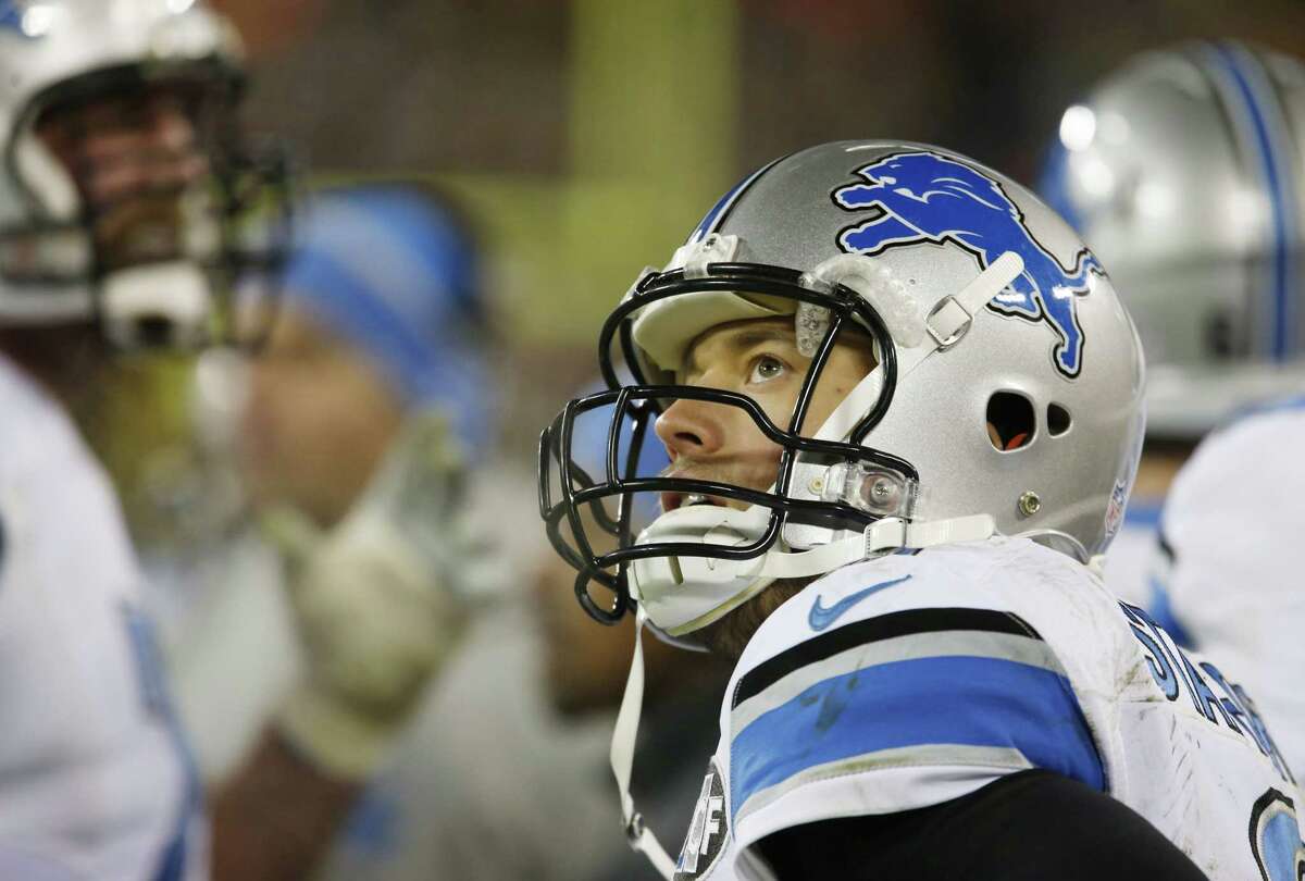 Detroit Lions quarterback Matthew Stafford watches from the bench during the second half of last Sunday’s game against the Packers in Green Bay, Wis.