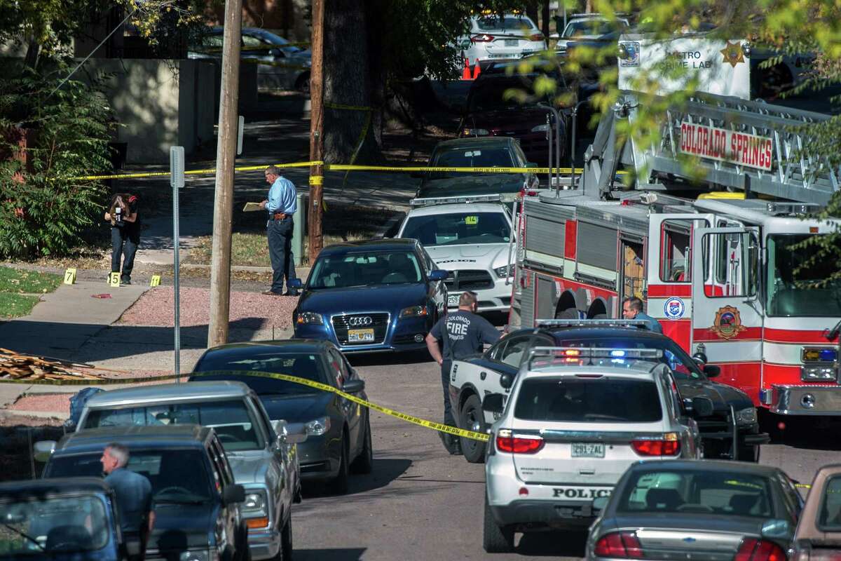Police investigate the scene after a shooting Saturday, Oct. 31, 2015, in Colorado Springs, Colo. Multiple are dead, including a suspected gunman, following a shooting spree according to authorities. Lt. Catherine Buckley said the crime scene covers several major downtown streets.