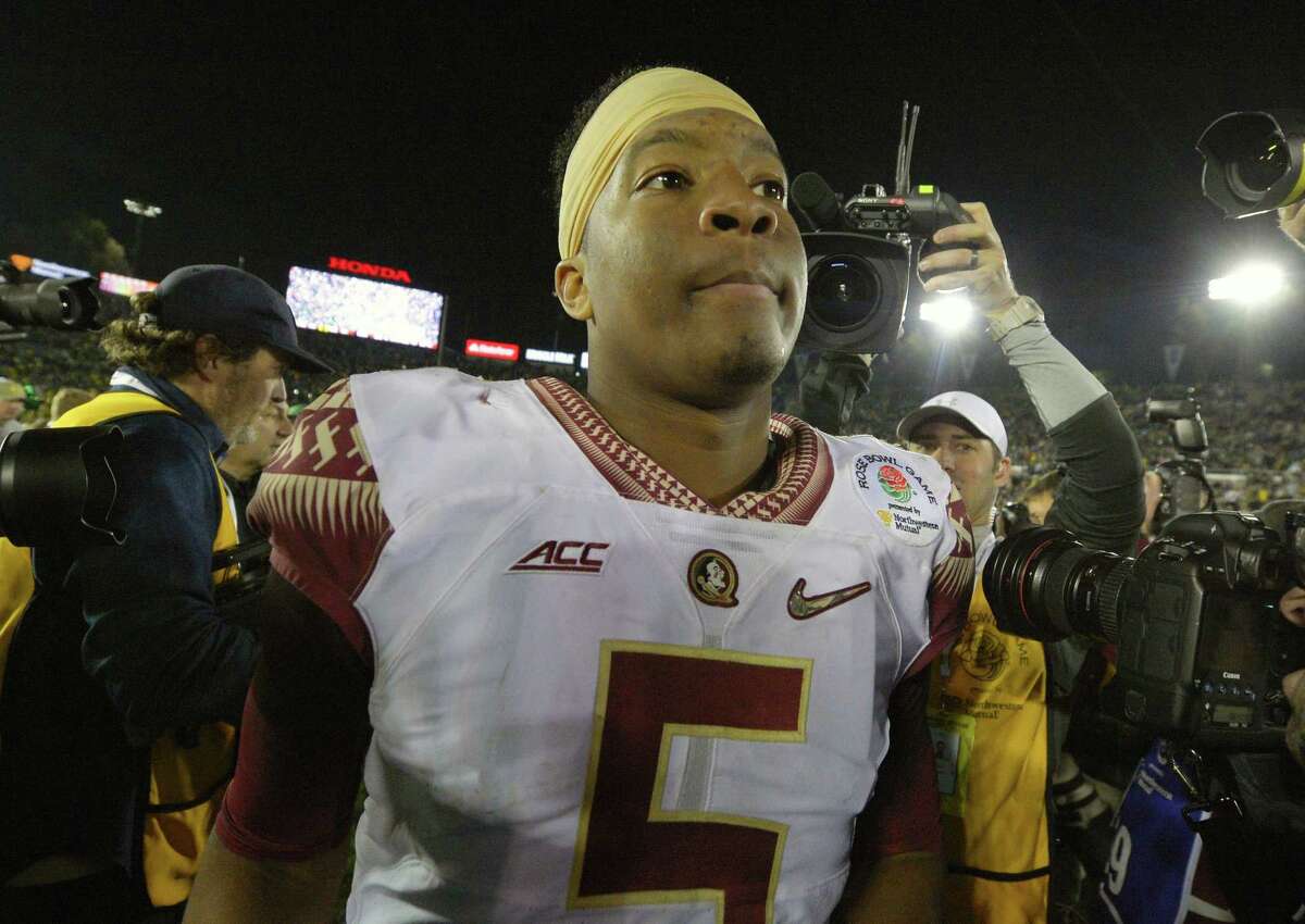 Florida State quarterback Jameis Winston walks off the field after the Seminoles’ loss to Oregon in the Rose Bowl on Thursday in Pasadena, Calif.
