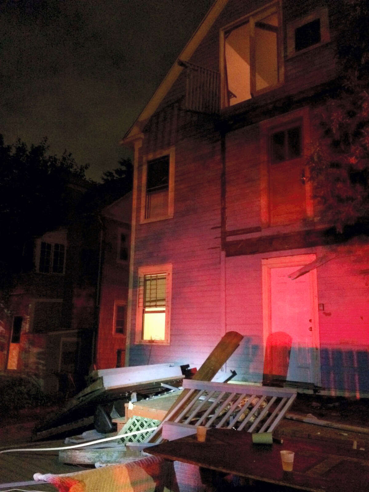 This photo provided by the Hartford Police Department shows a collapsed deck at a house near Trinity College in Hartford, Conn. on Sept. 10, 2016. Deputy Chief Brian Foley of the Hartford police posted on his Twitter feed that a third-floor deck of a house about two-tenths of a mile from the Trinity campus collapsed onto a second-floor deck, which subsequently fell onto a first-floor deck.