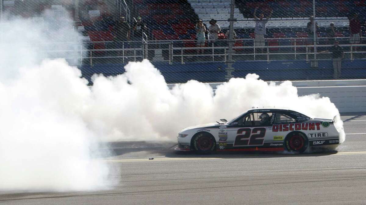 Winner Joey Logano celebrates with a burnout at the NASCAR Xfinity race at Talladega Superspeedway on Saturday in Talladega, Ala.