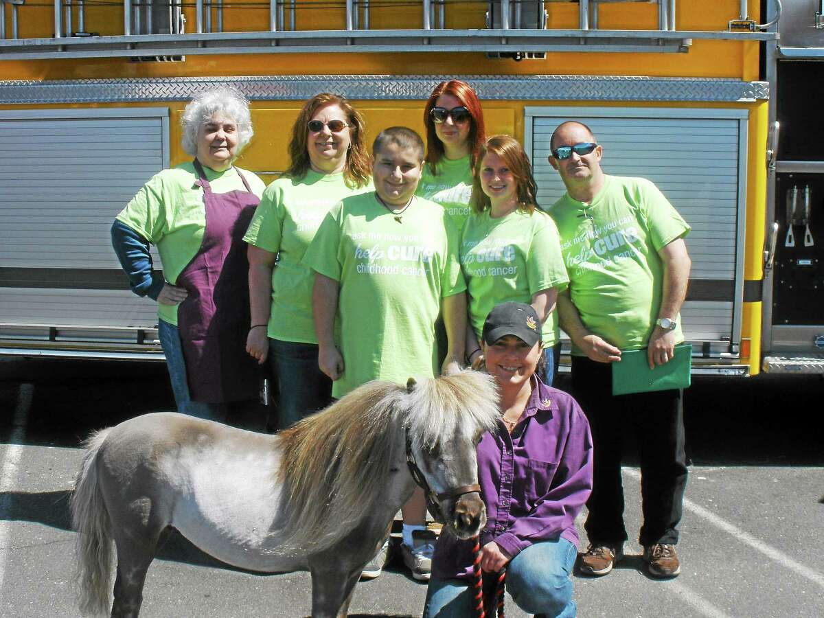Fran LaPaca, Sharon Hotchkiss, Steven Ross, and other volunteers help out at the Jimmy Fund fundraiser Saturday, May 2, 2015.