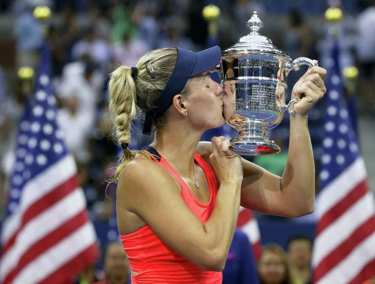 Angelique Kerber kisses the championship trophy after beating Karolina Pliskova in the women’s final at the U.S. Open on Saturday.