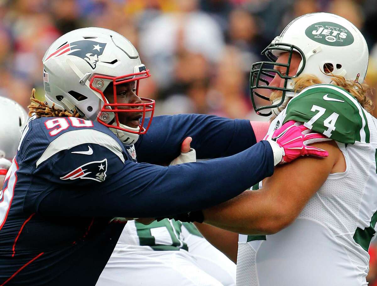 Patriots defensive tackle Malcom Brown battles Jets center Nick Mangold earlier this season.