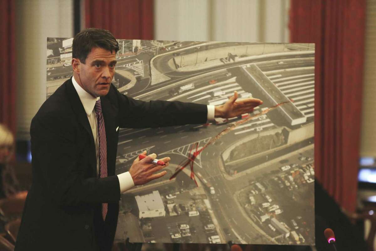FILE - In this Monday, Nov. 25, 2013, file photograph, taken in Trenton, N.J., Port Authority Executive Director Bill Baroni explains why the traffic entrances were closed onto the George Washington Bridge, causing traffic delays two months ago, with an aerial photo of the entrances and tolls on the GWB. Federal prosecutors have announced a court proceeding, scheduled for Friday, May 1, 2015, involving the 2013 traffic jams on the George Washington Bridge, an investigation that has loomed over New Jersey Gov. Chris Christie as he considers a presidential run. (Chris Pedota/The Record of Bergen County via AP) ONLINE OUT; MAGS OUT; TV OUT; INTERNET OUT; NO ARCHIVING; MANDATORY CREDIT