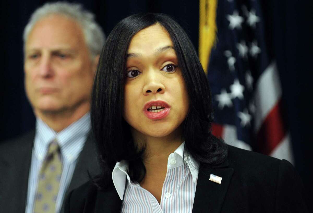 In this Feb. 3, 2015 photo, Marilyn Mosby, right, Baltimore City State’s Attorney, holds a press conference regarding the Phylicia Barnes case. At left is Deputy Chief Michael Schatzow. Prosecutors are charging Michael Johnson again in the death of Phylicia Barnes, the teenager from North Carolina who was visiting family.