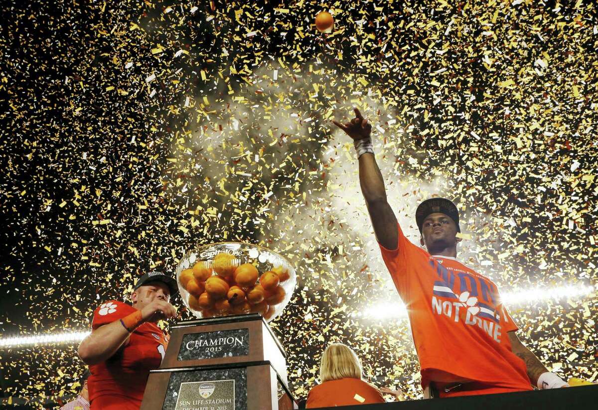 Clemson quarterback Deshaun Watson throws oranges to the crowd after his Tigers won the Orange Bowl college football playoff semifinal game against Oklahoma on Thursday in Miami Gardens, Fla.
