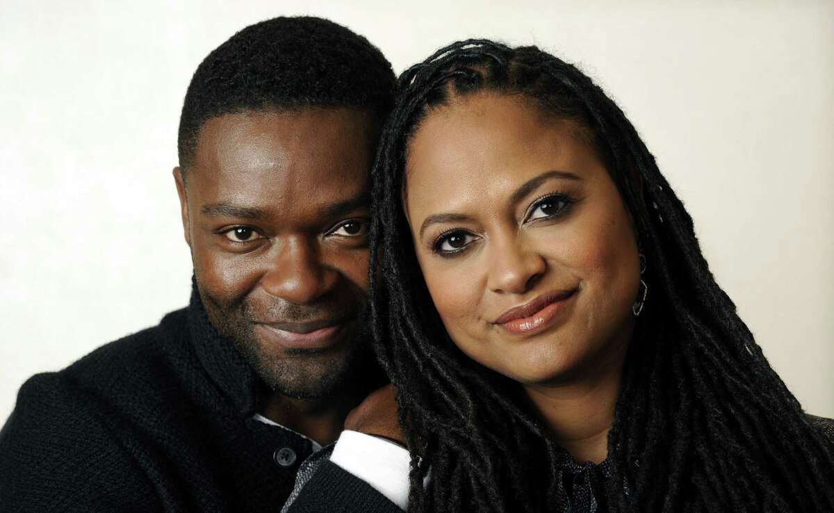In this Wednesday, Nov. 12, 2014 photo, Ava DuVernay, right, director of the film "Selma," and cast member David Oyelowo pose together at the Four Seasons Hotel in Los Angeles. DuVernay's film, which opens in limited release on Christmas Day and wide on Jan. 9, 2015, is earning her raves and awards buzz. (Photo by Chris Pizzello/Invision/AP)