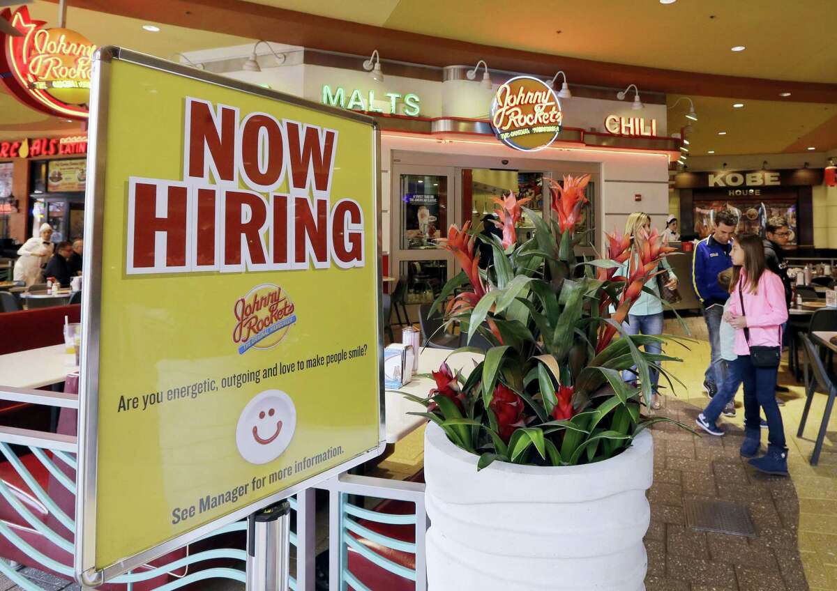 A restaurant posts a sign indicating they are hiring, in Miami. On Thursday, May 5, 2016, the Labor Department releases its weekly report on applications for unemployment benefits.