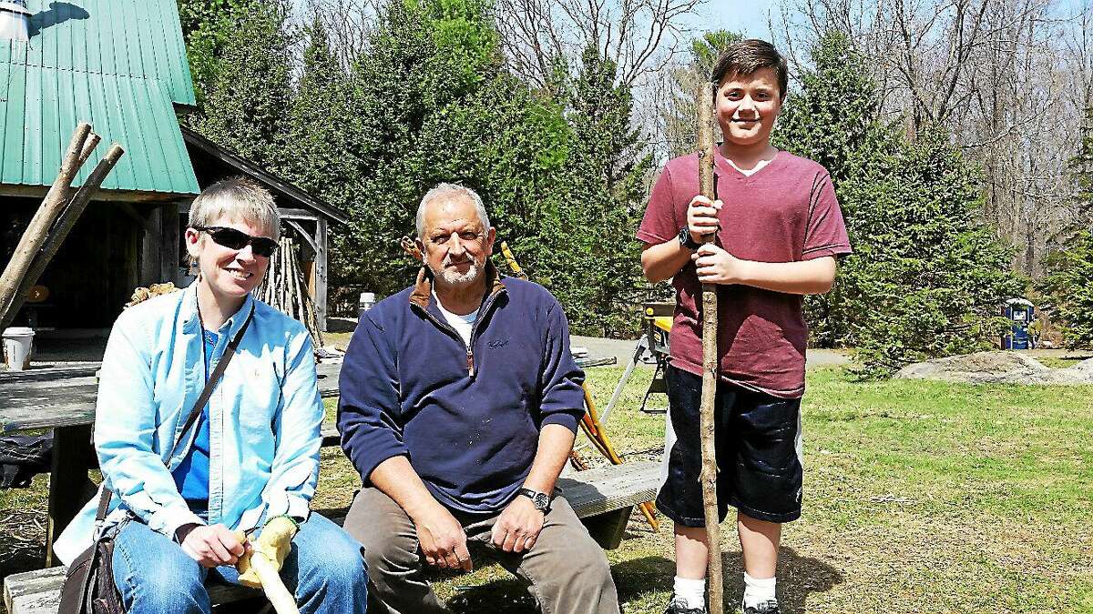 Linda Miller of New Milford, Connecticut Woodcarvers Association member Michael Audette of Thomaston, and Ryan Harrison, 11, of Torrington, attend an informal all-day wood carving presentation and workshop at the Flanders Nature Center in Woodbury on Sunday.