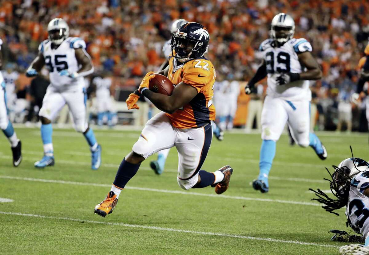 Broncos running back C.J. Anderson (22) runs in for a touchdown against the Panthers on Thursday.