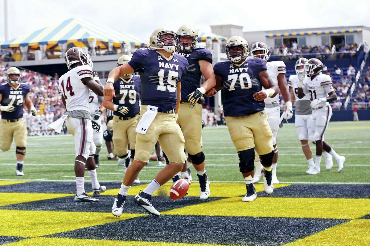 Navy’s Will Worth (15) celebrates a touchdown against Fordham earlier this season.