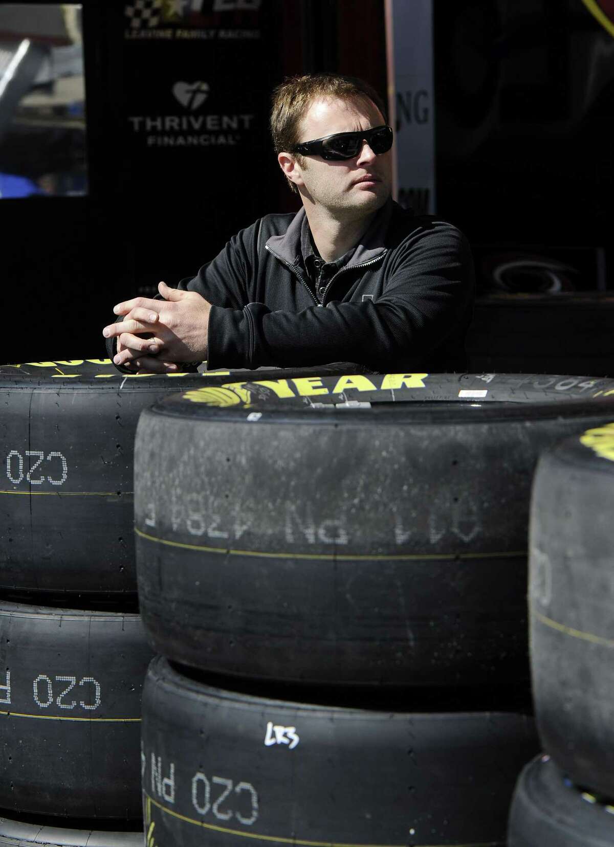 NASCAR driver Travis Kvapil waits in the garage Friday at Atlanta Motor Speedway.