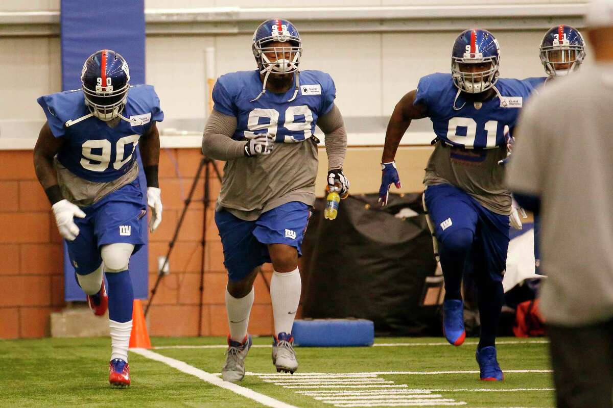 New York Giants defensive end Jason Pierre-Paul (90) works out during practice Wednesday in East Rutherford, N.J.