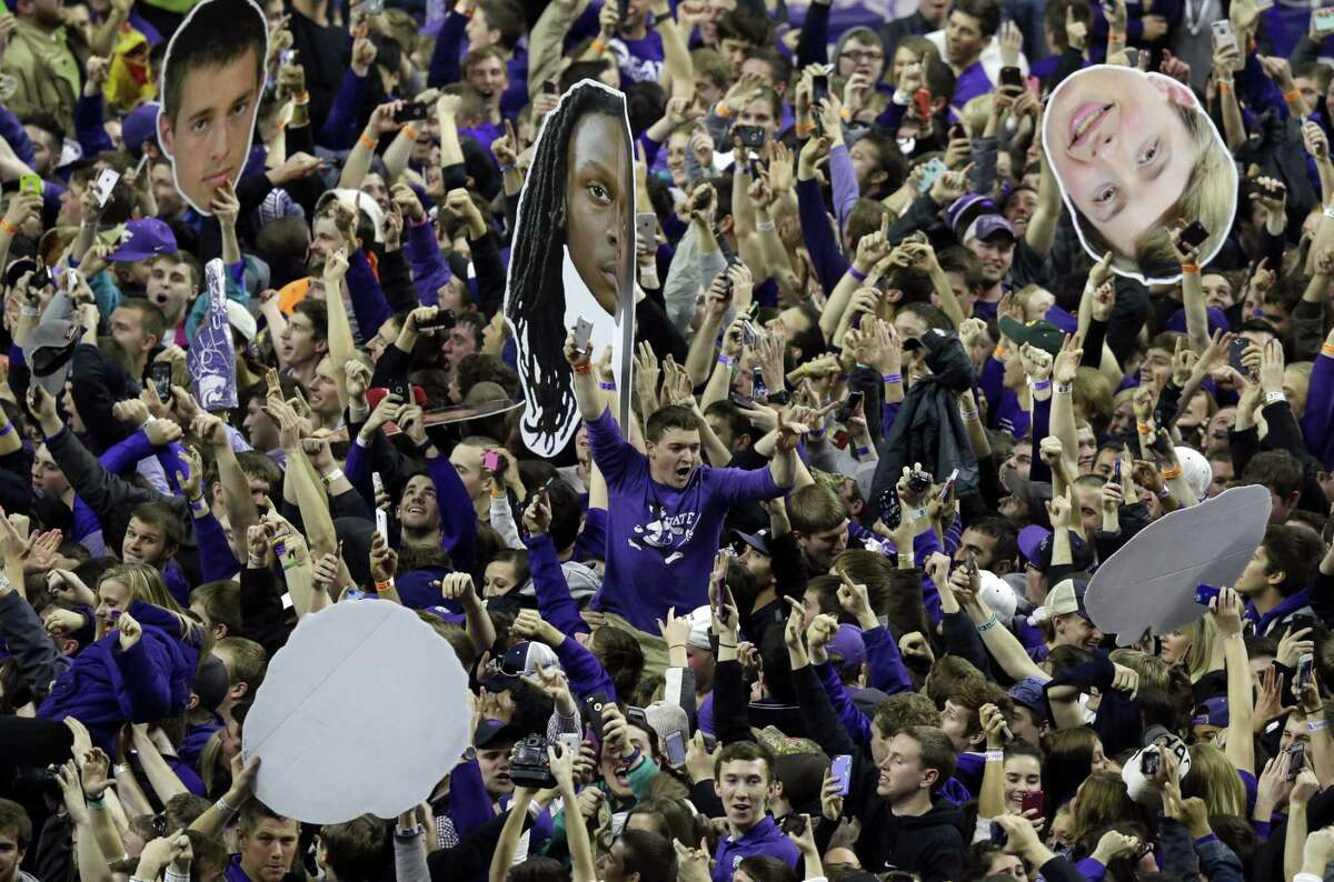 Kansas State fans celebrate following a win over Kansas at Bramlage Coliseum on Monday in Manhattan, Kan. Register sports columnist Chip Malafronte is calling for an end to court storming, but not just because it’s potentially dangerous. It’s also become cliched. Think of something new, student stormers!