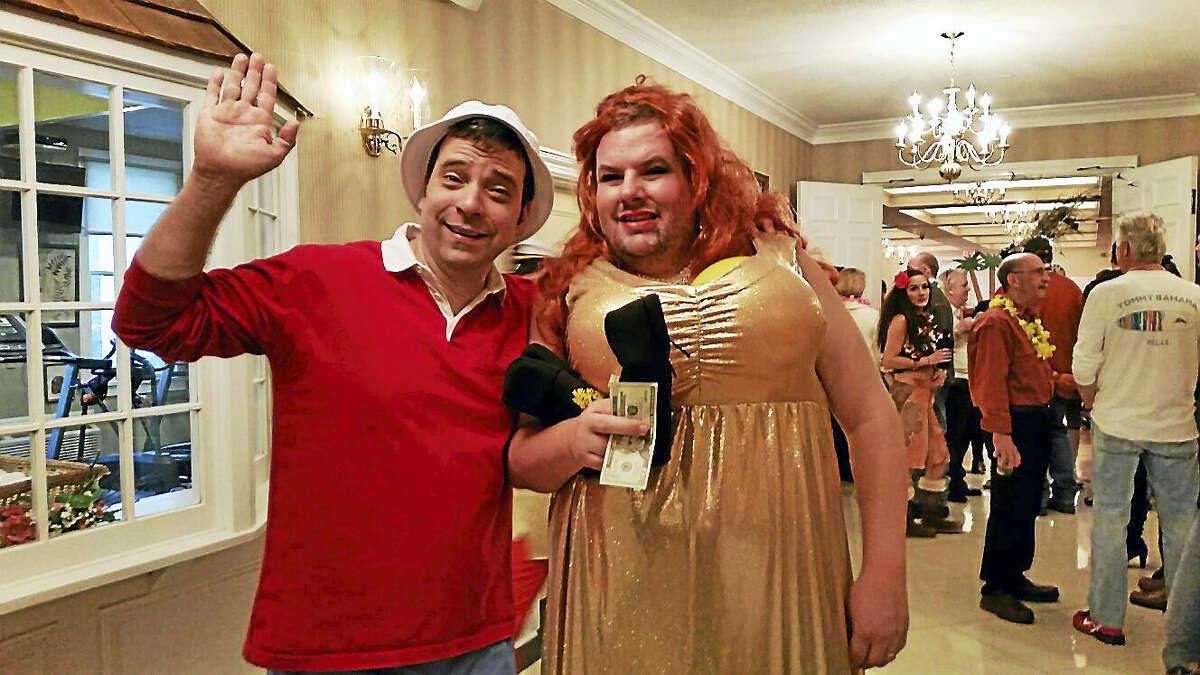 Ian Campbell as Gilligan and DJ Murphy as Ginger from the 1960s sitcom “Gilligan’s Island” posed after their spoof skit at the 26th annual Possum Queen Festival at the Litchfield Inn on Friday afternoon.