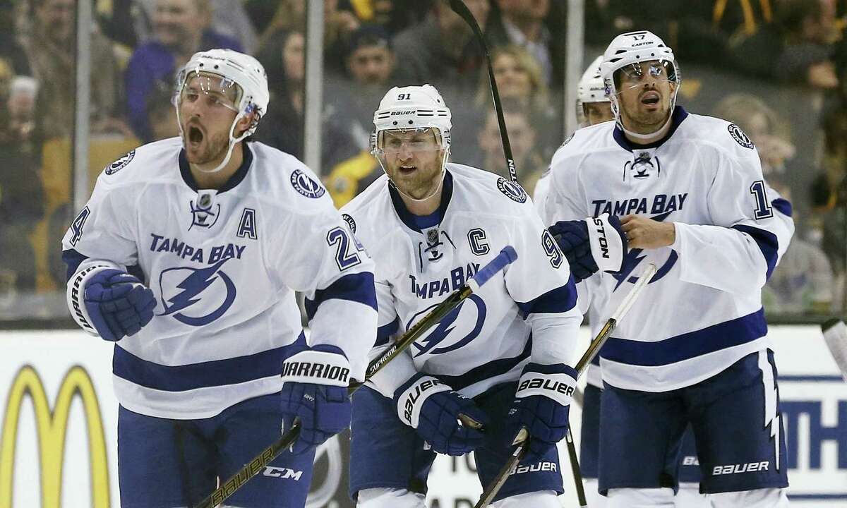 The Associated Press Tampa Bay Lightning’s Ryan Callahan (24) celebrates his goal in front of teammates Steven Stamkos (91) and Alex Killorn (17) during the second period Sunday.