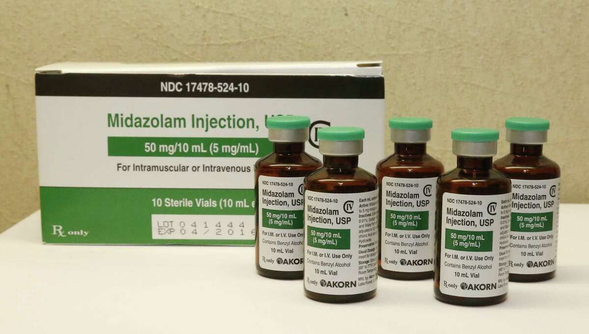 FILE - This Friday, July 25, 2014 file photo shows bottles of midazolam at a hospital pharmacy in Oklahoma City. On Monday, June 29, 2015, The Supreme Court voted 5-4 in a case from Oklahoma saying that the sedative midazolam can be used in executions without violating the Eighth Amendment prohibition on cruel and unusual punishment. (AP Photo/Sue Ogrocki, File)