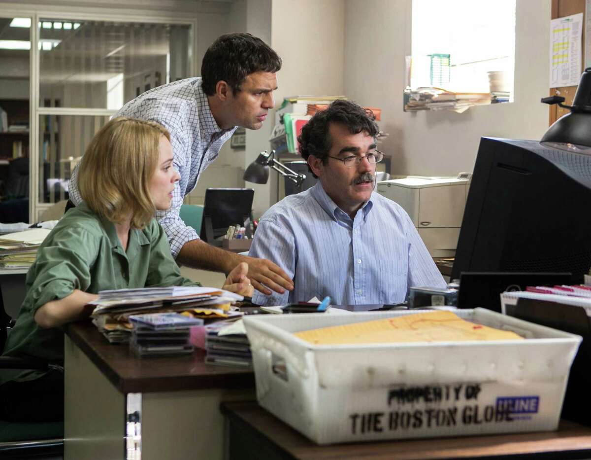 This photo provided by Open Road Films shows, Rachel McAdams, from left, as Sacha Pfeiffer, Mark Ruffalo as Michael Rezendes and Brian d’Arcy James as Matt Carroll, in a scene from the film, "Spotlight." (Kerry Hayes/Open Road Films via AP)