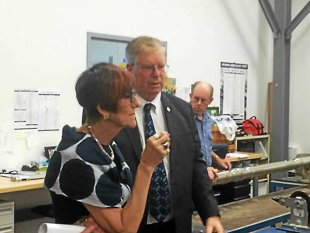U.S. Rep. Rosa L. DeLauro, D-3, tours APS Technology in Wallingford Tuesday with William Turner, the company’s chief executive officer.