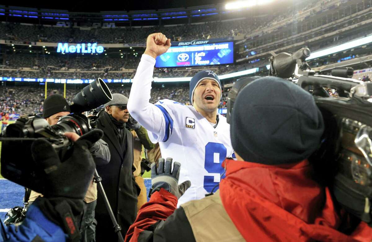 Dallas Cowboys quarterback Tony Romo (9) gestures while leaving the field after an NFL football game against the New York Giants, Sunday, Nov. 24, 2013 in East Rutherford, N.J. The Cowboys won 24-21.