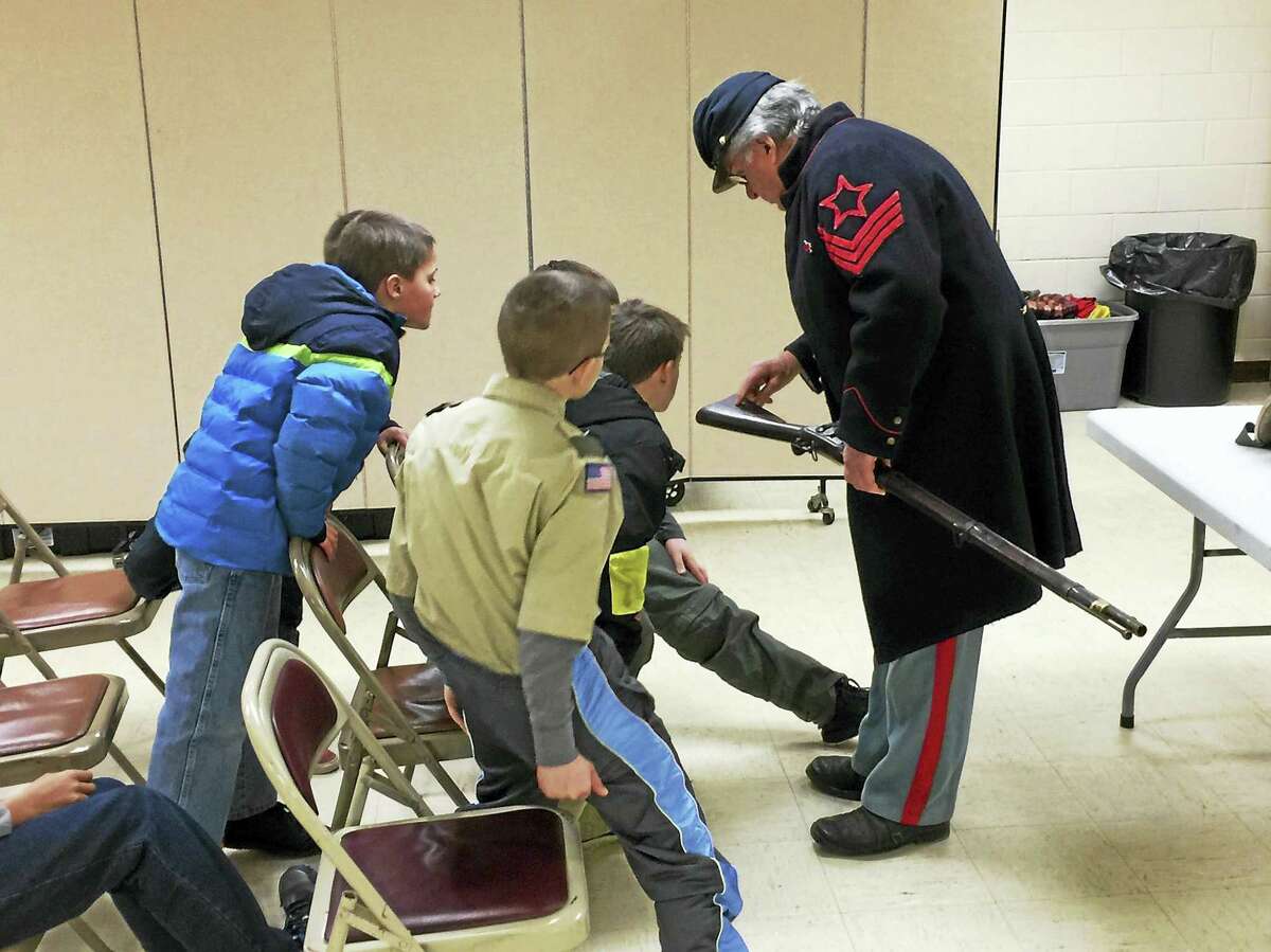 Members of Boy Scout Troop 3 hear from Civil War re-enactors Monday, as they prepare for an upcoming trip to Gettysburg.