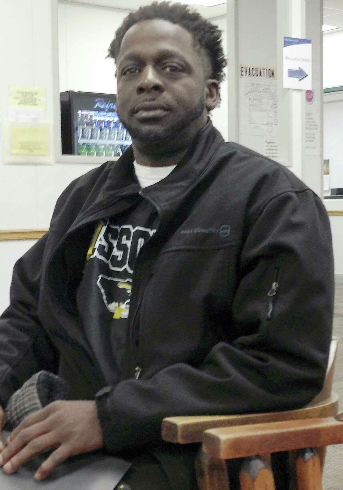 In this Feb 8, 2016 photo, Demetrius White sits in a chair at a state career center in Jefferson City, Mo. White, who is receiving unemployment benefits, had gone to the center to get information about temporary job agencies. He is among the first group of unemployed workers in Missouri whose maximum benefits were cut from 20 weeks to 13 weeks under a state law that took effect in January.